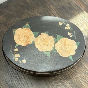 Vintage oval tin w/ handles , black w/ painted gardenias and Lilly of Valley